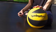 Load image into Gallery viewer, lady pumping a springfree trampoline ball